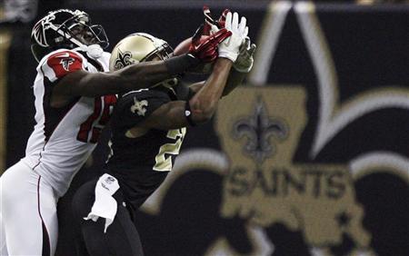 New Orleans Saints cornerback Corey White intercepts a pass away from Atlanta Falcons wide receiver Drew Davis during the second half of their NFL football game in New Orleans New Orleans Saints cornerback Corey White (24) intercepts a pass away from Atlanta Falcons wide receiver Drew Davis (19) during the second half of their NFL football game in New Orleans, Louisiana November 11, 2012. REUTERS/Sean Gardner