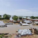 A village is seen submerged by floodwaters at the foot of the Murtala Mohammed Bridge in Lokoja, Kogi state September 24, 2012. Picture taken September 24, 2012. REUTERS/Afolabi Sotunde