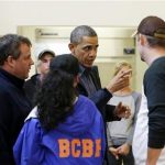 President Barack Obama, accompanied by New Jersey Gov. Chris Christie meets with local residents at the Brigantine Beach Community Center in Brigantine, NJ., Wednesday, Oct. 31, 2012. Obama traveled to Atlantic Coast to see first-hand the relief efforts after Superstorm Sandy damage the Atlantic Coast. (AP Photo/Pablo Martinez Monsivais)