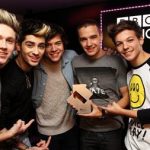 Members of boy band One Direction pose at the BBC's Radio One studio to mark their topping the British singles and album charts on Sunday November 18, 2012, in this handout publicity photo. Credit: Reuters/Handout