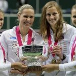Czech Republic's team members (L-R) Andrea Hlavackova, Lucie Hradecka, Petra Kvitova and Lucie Safarova celebrate with the trophy after winning their final match of the Fed Cup tennis tournament against Serbia in Prague November 4, 2012. REUTERS/David W Cerny