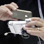 A man takes a picture of a Samsung Galaxy Camera during press preview day before the official start of the IFA consumer electronics fair in Berlin, in this August 30, 2012 file picture. South Korean consumer electronics giant Samsung Electronics Co is taking aim at its Japanese rivals with an Android-powered digital camera that allows users to swiftly and wirelessly upload pictures to social networking sites. REUTERS/Tobias Schwarz/File