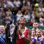 Serena Williams of the U.S. celebrates with the trophy after her victory against Russia's Maria Sharapova after their final WTA tennis championships match in Istanbul, October 28, 2012. REUTERS/Osman Orsal