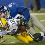 New York Giants middle linebacker Chase Blackburn (93) sacks Green Bay Packers quarterback Aaron Rodgers (12) in the first quarter of their NFL football game in East Rutherford, New Jersey November 25, 2012. REUTERS/Ray Stubblebine