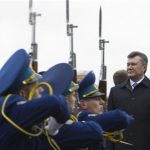 Ukrainian President Viktor Yanukovich (R) inspects the guard of honor during a ceremony to mark the day of Ukraine's liberation from Nazi invaders during World War Two on the day of the parliamentary elections in Kiev, October 28, 2012. REUTERS/Mykhailo Markiv/Presidential Press Service/Handout