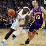 Denver Nuggets guard Ty Lawson (3) drives against Los Angeles Lakers guard Steve Nash in the fourth quarter of their NBA basketball game in Denver, Wednesday, Dec. 26, 2012. The Nuggets won 126-114. (AP Photo/David Zalubowski)