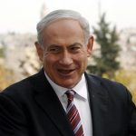 Israeli Prime Minister Benjamin Netanyahu (C) speaks during his meeting with ambassadors to Israel from Asia, in Jerusalem December 19, 2012. REUTERS/Ronen Zvulun