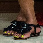 Michelle Obama has a very neon Christmas with highlighter yellow pedicure in Hawaii