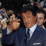U.S. actor Sylvester Stallone poses with fans as he arrives for the German premiere of his movie "The Expendables" in Berlin in this August 6, 2010 file photo. A federal judge has reaffirmed his decision to dismiss a lawsuit accusing Stallone of copying someone else's screenplay to make his popular 2010 movie "The Expendables." U.S. District Judge Jed Rakoff in Manhattan on December 27, 2012 rejected claims of copyright infringement damages by Marcus Webb, who contended that the movie's screenplay contained 20 "striking similarities" to his own "The Cordoba Caper." REUTERS/Thomas Peter/Files