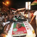 Supporters of National Democratic Congress (NDC), the party of the late Ghanaian President John Atta Mills, celebrate the victory of their candidate, John Dramani Mahama, along a street in Accra December 9, 2012. Ghana's main opposition party said on Sunday the country's presidential election had been manipulated, raising concerns about the outcome of the poll in a nation seen as a bulwark of democracy in an unstable region. REUTERS/Luc Gnago