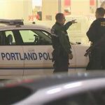 A still image taken from video courtesy of KATU-TV shows Portland police officers at a shooting scene at Clackamas Town Center in Portland, Oregon, December 11, 2012. A gunman opened fire inside an Oregon shopping mall on Tuesday in the middle of the busy Christmas shopping season, killing at least two persons before the shooter was "neutralized," police said. REUTERS/KATU-TV/Handout