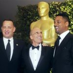 DreamWorks Animation Studio Executive Jeffrey Katzenberg, (C) who is due to receive the Jean Hersholt Humanitarian Award at the Academy of Motion Picture Arts & Sciences 4th annual Governors Awards, poses with actors Tom Hanks (L) and Will Smith at the event December 1, 2012 in Hollywood. REUTERS/Fred Prouser