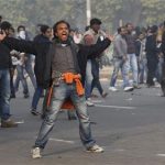 A demonstrator shouts slogans during a protest in front of India Gate in New Delhi December 23, 2012. REUTERS/Adnan Abidi