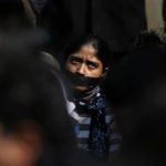 A protester with a gag tied around her mouth takes part in a silent protest for a gang rape victim in New Delhi December 29, 2012. REUTERS/Adnan Abidi