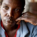 In this photo taken Friday, Dec. 14, 2012, Maimouna Awuor, 44, speaks to The Associated Press In Nairobi, Kenya. The director of the Pumwani Maternity Hospital, located in a hardscrabble neighborhood of downtown Nairobi, freely acknowledges what he's accused of: detaining mothers who can't pay their bills. Lazarus Omondi says it's the only way he can keep his medical center running. Awuor and another mother told The Associated Press that Pumwani wouldn't let them leave after delivering their babies. (AP Photo/Sayyid Azim)