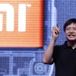 Lei Jun, founder and CEO of China's mobile company Xiaomi, speaks next to his company's logo at a launch ceremony of Xiaomi Phone 2 in Beijing in this August 16, 2012 file photo. REUTERS/Jason Lee/Files