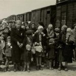In this May 1944 photo provided by Yad Vashem Photo Archives, Jewish women and children deported from Hungary, separated from the men, line up for selection on the selection platform at Auschwitz camp in Birkenau, Poland. Johann Hans Breyer, 87, of Philadelphia admits he was a guard at Auschwitz, but says he was never in Auschwitz-Birkenau, the part of the death camp used as a killing machine for Jews. World-War II-era documents obtained by The Associated Press indicate otherwise. Those files are now in the hands of German authorities, and could provide the legal basis for charging Breyer as an accessory to the murder of hundreds of thousands of Jews in the Nazi death camp. (AP Photo/Yad Vashem Photo Archives)