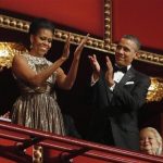 U.S. President Barack Obama (R) and first lady Michelle Obama applaud on the balcony as they attend the 2012 Kennedy Center Honors at the Kennedy Center in Washington, December 2, 2012. REUTERS/Jason Reed