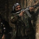 Free Syrian Army fighters take their positions as one of them fires during clashes with forces loyal to Syria's President Bashar al-Assad in Qastal Harami area in Aleppo in this picture released December 19, 2012. Picture released December 19, 2012. REUTERS/Saad Al-Jabri