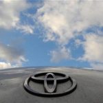 A Toyota Logo is pictured on a Prius car at a Toyota dealership in west London February 9, 2010. REUTERS/Toby Melville