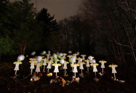 Wood painted angels are displayed outside a home to honor the victims killed at Sandy Hook Elementary School in Newtown Twenty-seven wood painted angels are displayed outside of a home to honor the victims killed at Sandy Hook Elementary School in Newtown, Connecticut December 16, 2012. Twelve girls, eight boys and six adult women were killed in the shooting on Friday at Sandy Hook Elementary School in Newtown. REUTERS/Joshua Lott
