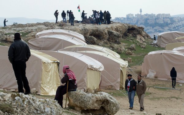 Palestinians erected tents in the contested piece of Israeli-occupied West Bank territory known as E1 on Friday.