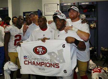 Members of the San Francisco 49ers pose in locker room with NFC championship banner after they defeated the Atlanta Falcons in the NFL NFC Championship football game in Atlanta, Georgia January 20, 2013. REUTERS/Jeff Haynes