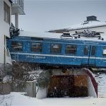 A local train that derailed and crashed into a residential building in Saltsjobaden is seen outside Stockholm in this picture taken by Scanpix Sweden January 15, 2013. According to local media, a spokesman from Arriva, the company that operates the train line, says the train was stolen by a domestic cleaner, who stole the train for unknown reasons. The cleaner was taken to a hospital after the crash. No residents in the building were injured. REUTERS/Jonas Ekstromer/Scanpix Sweden