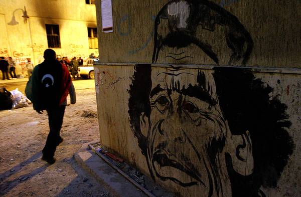 The eastern city of Benghazi, Libya, was an opposition stronghold in the uprising against Moammar Kadafi. In spring 2011, caricatures of Kadafi, such as this oen, were visible around the city. (Luis Sinco / Los Angeles Times / April 3, 2011)