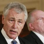 U.S. President Barack Obama's nominee for Secretary of Defense, former Senator Chuck Hagel (L), stands next to counterterrorism adviser John Brennan (R), the nominee for CIA Director, at the White House in Washington January 7, 2013. REUTERS/Jason Reed