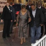 Cissy Houston, mother of the late singer Whitney Houston, is escorted as she bypasses the red carpet at the premiere of the new film "Sparkle" in Hollywood, California August 16, 2012. Houston's son Gary Houston (R) is seen walking behind her. REUTERS/Fred Prouser