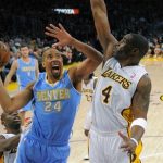 Denver Nuggets guard Andre Miller, center, goes up for a shot as Los Angeles Lakers forward Antawn Jamison, right, defends and guard Jodie Meeks looks on during the first half of their NBA basketball game, Sunday, Jan. 6, 2013, in Los Angeles. (AP Photo/Mark J. Terrill)