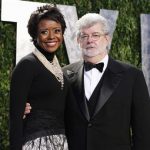 Director George Lucas and his partner Mellody Hobson arrive at the 2012 Vanity Fair Oscar party in West Hollywood, California in this February 26, 2012, file photo. Lucas has become engaged to his longtime girlfriend Hobson, according to media reports, January 3, 2013. REUTERS/Danny Moloshok/Files