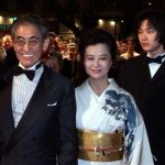 Japanese director Nagisa Oshima (L) arrives with his wife (C) and actor Ryuhei Matsuda (R) as they arrive on the red carpet at the festival palace May 16. Oshima and his cast present their film 'Gohatto' (Taboo) which competes for the Palme d'Or (Golden Palm) at the 53rd Cannes Film Festival May 16. JES/