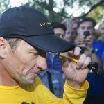 Lance Armstrong walks back to his car after running at Mount Royal park with fans in Montreal August 29, 2012. REUTERS/Christinne Muschi