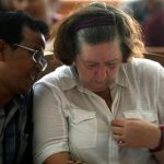 Lindsay June Sandiford of Britain, right, listens to her interpreter during her sentencing at a courthouse, in Denpasar, Bali island, Indonesia, Tuesday, Jan. 22, 2013. The Indonesian court sentenced Sandiford to death on Tuesday for smuggling cocaine worth $2.5 million into the resort island of Bali  even though prosecutors had sought only a 15-year sentence. (AP Photo/Firdia Lisnawati)