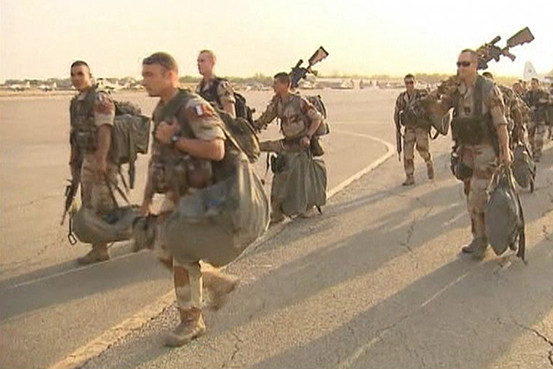 French troops walk to a plane in Ndjamena, Chad, in a still image from video released by the French Army on Saturday.
