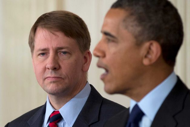 Richard Cordray stands left as President Barack Obama announces in the State Dining Room of the White House in Washington, Thursday, Jan. 24, 2013, that he will re-nominate Cordray to lead the Consumer Financial Protection Bureau, a role that he has held for the last year under a recess appointment, and nominate Mary Joe White to lead the Security and Exchange Commission (SEC). Photo: Carolyn Kaster