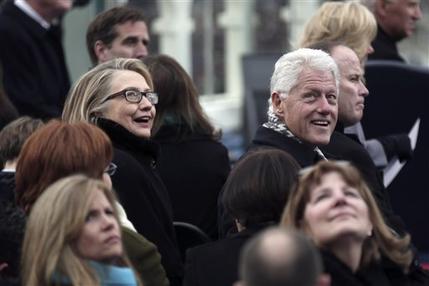 Secretary of State Hillary Rodham Clinton and former president Bill Clinton look on during the ceremonial swearing-in ceremony during the 57th President Inauguration, Monday, Jan. 21, 2013, on the West Front of the Capitol in Washington.  (AP Photo/Win McNamee, Pool)