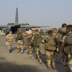 French troops prepare to board a transport plane in N'Djamena, Chad, in this photo released by the French Army Communications Audiovisual office (ECPAD) on January 12, 2013. REUTERS/ECPAD/Adj. Nicolas Richard/Handout