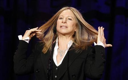Singer and actress Barbra Streisand reacts as she speaks on stage at the Public Counsel's 40th anniversary event in Beverly Hills, California March 18, 2011. REUTERS/Mario Anzuoni