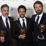 Ben Affleck (R), George Clooney (L) and Grant Heslvov celebrate after winning the Award for Best Film for the movie "Argo" at the British Academy of Film and Arts (BAFTA) awards ceremony at the Royal Opera House in London February 10, 2013. REUTERS/Suzanne Plunkett (BRITAIN - Tags: ENTERTAINMENT) (BAFTA-WINNERS)