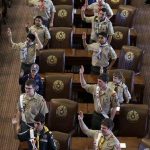 FILE - In this Feb. 2, 2013 file photo, Boy Scouts recite the Scout Oath during the annual Boy Scouts Parade and Report to State in the House Chambers at the Texas capitol, in Austin, Texas. President Barack Obama said Sunday, Feb. 3, 2013 that gays should be allowed in the Boy Scouts and women should be allowed in military combat roles. (AP Photo/Eric Gay, File)