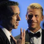FILE - In this Sept. 15, 2012 file photo, Dan Savage, left, and Terry Miller pose backstage with the Governors Award for the "It Gets Better Project" at the 2012 Creative Arts Emmys at the Nokia Theatre in Los Angeles. A new Pediatrics study found scientific evidence that it does get better for gay teens, when it comes to bullying, although young gay men fare worse than their lesbian peers. (Photo by Chris Pizzello/Invision/AP)