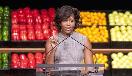 FILE - In this Jan. 20, 2011 file photo, first lady Michelle Obama takes part in Wal-Mart's announcement of a comprehensive effort to provide healthier and more affordable food choices to their customers, in Washington. Recent changes put in place by the food industry are in response to the campaign against childhood obesity that Obama began waging three years ago. (AP Photo/Cliff Owen, File)