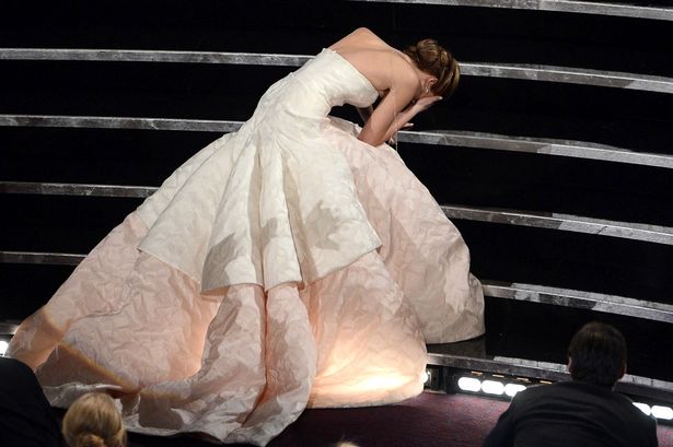 "That was embarrassing": Jennifer Lawrence trips and falls up stage stairs collecting her Oscar, video