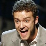 Singer Justin Timberlake reacts as he holds two of his awards for songs "My Love" and "Until the End of Time" during the 25th Annual ASCAP Pop Music Awards at the Kodak Theatre in Hollywood, California, April 9, 2008. REUTERS/Danny Moloshok