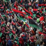 People wave Libyan flags during celebrations commemorating the second anniversary of the country's February 17 revolution, at Martyrs' Square in Tripoli February 17, 2013. REUTERS/Ismail Zitouny