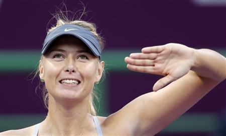Maria Sharapova of Russia reacts after defeating Samantha Stosur of Australia during their women's quarter-final match at the Qatar Open tennis tournament in Doha February 15, 2013. REUTERS/Fadi Al-Assaad