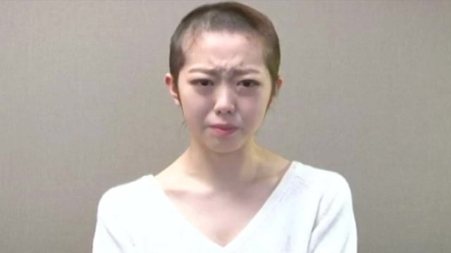 AKB48 pop star shaves head after breaking band rules